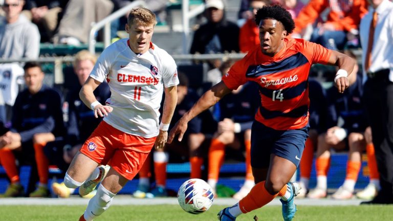 Clemson's Brandon Parrish battles Syracuse's Levonte Johnson for control of the ball during the first half of the Atlantic Coast Conference Men's Soccer Tournament championship match in Cary, N.C., Sunday, Nov. 13, 2022. (Karl B DeBlaker/AP)