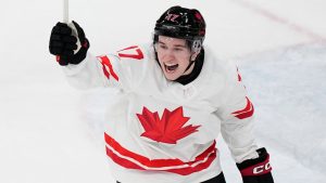 Canada's Macklin Celebrini celebrates after scoring his sides first goal during a preliminary round match of men's ice hockey between Czech Republic and Canada at the 2026 Winter Olympics, in Milan, Italy, Thursday, Feb. 12, 2026. (Petr David Josek/AP)