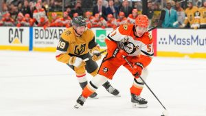 Anaheim Ducks defenseman Olen Zellweger (51) skates with the puck against Vegas Golden Knights left wing Ivan Barbashev (49) during the third period of Game 5 of a second-round Stanley Cup playoff series Tuesday, May 12, 2026, in Las Vegas. (Candice Ward/AP)