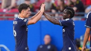 Vancouver Whitecaps FC midfielder Sebastian Berhalter, left, celebrates his goal with teammate Emmanuel Sabbi during the first half of an MLS match against FC Dallas in Frisco, Texas, Wednesday, May 13, 2026. (LM Otero/AP)