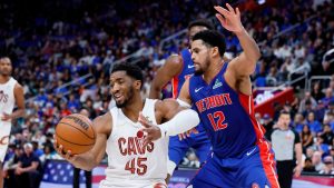 Cleveland Cavaliers guard Donovan Mitchell (45) is guarded by Detroit Pistons forward Tobias Harris (12) under the basket during the second half in Game 5 of a second-round NBA playoffs series Wednesday, May 13, 2026, in Detroit. (Duane Burleson/AP)