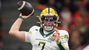 Edmonton Elks quarterback Cody Fajardo passes during the second half of a CFL game against the B.C. Lions, in Vancouver, on Friday, October 17, 2025. (Darryl Dyck/CP)