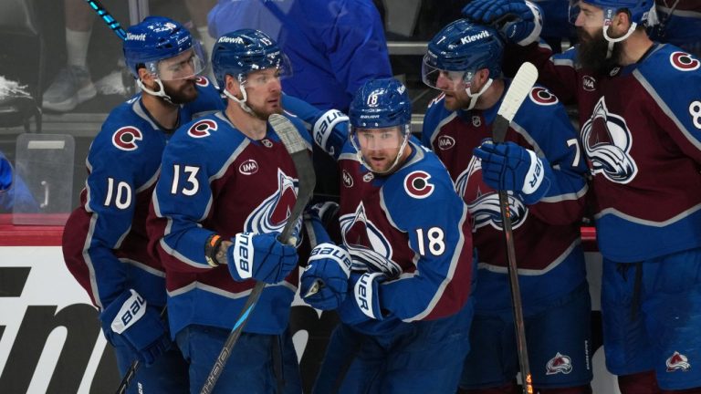 Colorado Avalanche center Jack Drury, center, is congratulated by, from left, center Nicolas Roy, right wing Valeri Nichushkin, and defensemen Devon Toews and Brent Burns in the third period of Game 5 of an Stanley Cup second-round playoff series against the Minnesota Wild Wednesday, May 13, 2026, in Denver. (David Zalubowski/AP)
