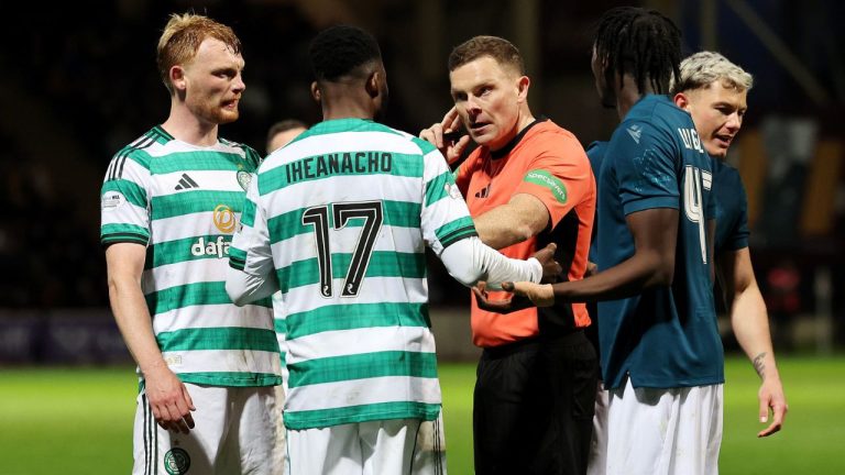 Referee John Beaton, center, speaks to Celtic's Kelechi Iheanacho before going to the VAR monitor and awarding a penalty to Celtic during the Scottish Premiership soccer match between Motherwell and Celtic, Wednesday May 13, 2026, in Motherwell, Scotland. (Robert Perry/PA via AP)