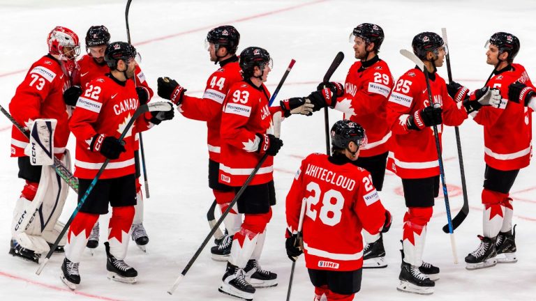 Canada's players celebrate after defeating Sweden in a Group B preliminary round game between Canada and Sweden at the men's ice hockey world championship in Fribourg, Switzerland, Friday, May 15, 2026. (Salvatore Di Nolfi/AP)