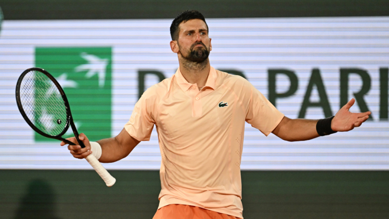 Novak Djokovic of Serbia celebrates after winning the first round men's singles tennis match against against Giovanni Mpetshi Perricard of France at the French Open tennis tournament in Paris, Sunday, May 24, 2026. (Emma Da Silva/AP)