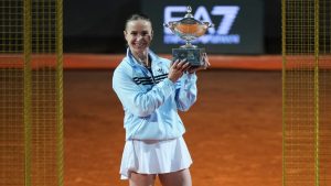 Ukraine's Elina Svitolina holds the trophy after winning against United States' Coco Gauff at the end of the women's final match at the Italian Open tennis tournament in Rome, Saturday, May 16, 2026. (AP Photo/Andrew Medichini)