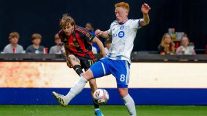 Atlanta United forward Saba Lobjanidze (11) shoots against CF Montreal midfielder Matthew Longstaff (8) during the first half of an MLS soccer match, Saturday, May 2, 2026, in Atlanta. (AP Photo/Erik S. Lesser)