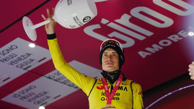 Denmark's Jonas Vingegaard celebrates on the podium after winning the 9th stage of the Giro d'Italia cycling race, from Cervia to Corrno alle Scale, Italy, Sunday May 17, 2026. (Massimo Paolone/AP)