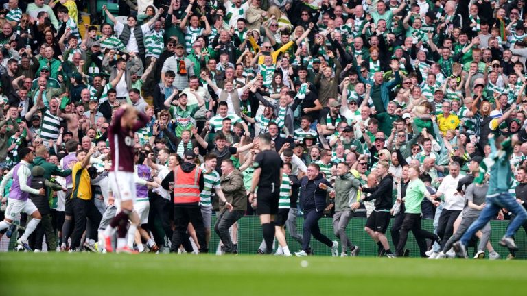 Celtic fans celebrate their side's victory over Heart of Midlothian following the Premiership soccer match between Celtic and Heart of Midlothian, in Glasgow, Scotland, Saturday May 16, 2026. (Andrew Milligan/AP)
