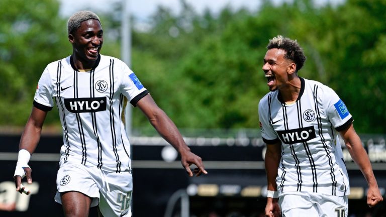 Elversberg's David Mokwa, left, celebrates scoring their second goal of the game with Bambase Conte during the Bundesliga 2 soccer match between SV Elversberg and SC Preußen Münster in Spiesen-Elversberg, Germany, Sunday May 17, 2026. (Uwe Anspach/AP)