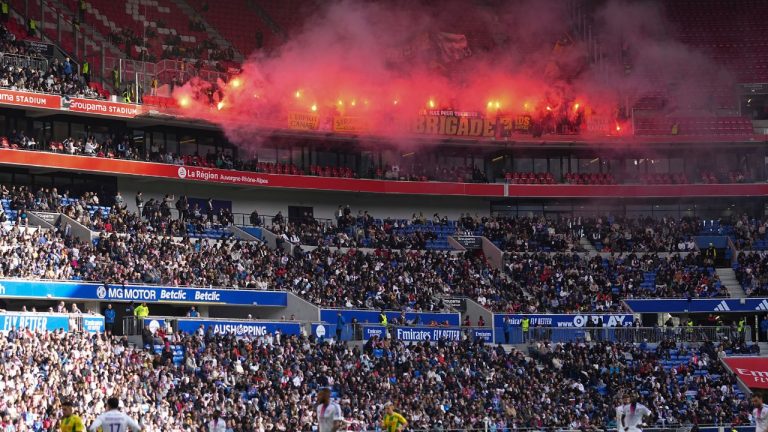 Nantes' fans burn flares during the French League One soccer match between Lyon and FC Nantes at the Groupama stadium in Decines, outside Lyon, France, Oct. 6, 2024. (Laurent Cipriani/AP)