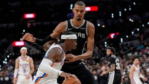 Oklahoma City Thunder guard Shai Gilgeous-Alexander (2) moves against San Antonio Spurs forward Victor Wembanyama (1) in the second half of Game 6 in the Western Conference finals NBA basketball playoffs series, Thursday, May 28, 2026, in San Antonio. (David J. Phillip/AP)