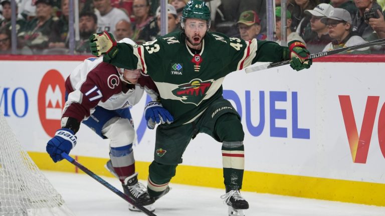 Minnesota Wild defenceman Quinn Hughes (43) looks toward a referee while defended by Colorado Avalanche centre Parker Kelly (17) during the second period of Game 3 of an NHL Stanley Cup hockey second-round playoff series Saturday, May 9, 2026, in St. Paul, Minn. (Abbie Parr/AP)
