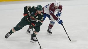 Minnesota Wild left wing Kirill Kaprizov (97) skates with the puck as Colorado Avalanche right wing Logan O'Connor (25) defends during the first period of Game 3 of an NHL Stanley Cup hockey second-round playoff series Saturday, May 9, 2026, in St. Paul, Minn. (Abbie Parr/AP)