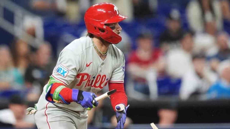 Philadelphia Phillies' Bryce Harper watches his hit after breaking his bat on a single during the eighth inning of a baseball game against the Miami Marlins, Monday, May 4, 2026, in Miami. (Rebecca Blackwell/AP)