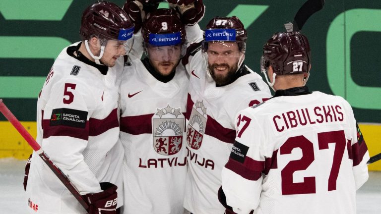 From left, Latvia's Arturs Andzans, Latvia's Renars Krastenbergs, Latvia's Haralds Egle and Latvia's Oskars Cibulskis celebrate their side's sixth goal during the 2026 IIHF Men's Ice Hockey World Championship preliminary round group A game between Hungary and Latvia, in Zurich, Switzerland, Tuesday, May 26, 2026. (Claudio Thoma/Keystone via AP)