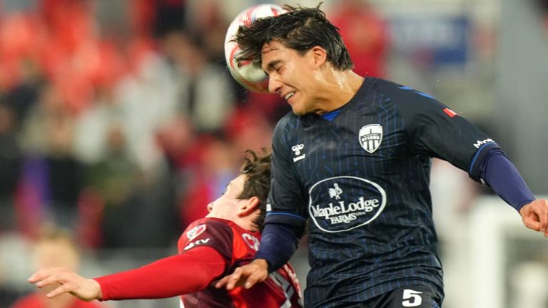 Atletico Ottawa's Daniel Aguilar, right, wins a ball against Toronto FC's Marcus Cimermancic during first half Canadian Championship action in Toronto, on Tuesday, May 5, 2026. (Chris Young/THE CANADIAN PRESS)