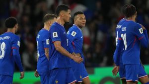 France's Kylian Mbappe celebrates with team mates his side's third goal during a World Cup 2026 group D qualifying soccer match between France and Ukraine in Paris, Thursday, Nov. 13, 2025. (Christophe Ena/AP)