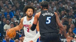 Detroit Pistons guard Cade Cunningham (2) looks for a way past Orlando Magic forward Paolo Banchero (5) during the first half in Game 6 of a first-round NBA basketball playoff series, Friday, May 1, 2026, in Orlando, Fla. (John Raoux/AP)