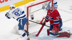 Tampa Bay Lightning's Gage Goncalves (93) celebrates his goal over Montreal Canadiens goaltender Jakub Dobes (75) during overtime NHL playoff hockey action in Montreal on Friday, May 1, 2026. (Christinne Muschi/CP)