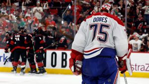 Carolina Hurricanes players celebrate after a goal by Nikolaj Ehlers as Montreal Canadiens goaltender Jakub Dobes (75) returns to the net during the second period in Game 2 of the Eastern Conference final NHL hockey Stanley Cup playoff series in Raleigh, N.C., Saturday, May 23, 2026. (Karl DeBlaker/AP)