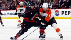 Carolina Hurricanes' Jordan Staal (11) battles Philadelphia Flyers' Jamie Drysdale (9) for the puck during the second period of Game 2 of an NHL hockey Stanley Cup second-round playoff series in Raleigh, N.C., Monday, May 4, 2026. (Karl DeBlaker/AP Photo)