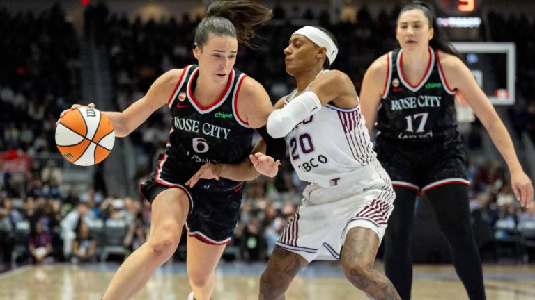 Portland Fire guard Bridget Carleton (6) drives against Toronto Tempo guard Brittney Sykes (20) during first half WNBA basketball action in Toronto, on Saturday May 23, 2026 (Frank Gunn/CP)