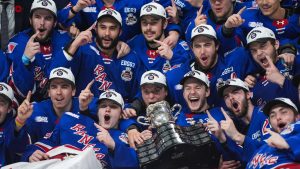 Kitchener Rangers players pose for a team photo after defeating the Everett Silvertips to win the Memorial Cup final hockey game, in Kelowna, B.C., on Sunday, May 31, 2026. (Darryl Dyck/THE CANADIAN PRESS)