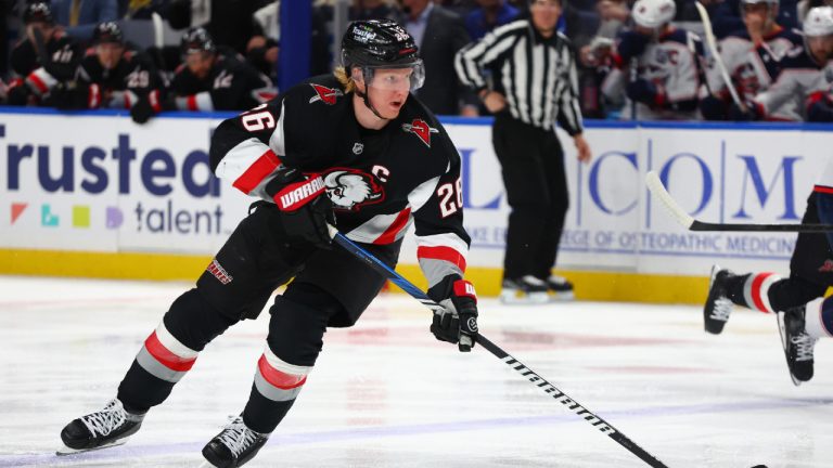 Buffalo Sabres defenceman Rasmus Dahlin (26) carries the puck over the blue line during the first period of an NHL hockey game against the Columbus Blue Jackets Thursday, April 9, 2026, in Buffalo, N.Y. (Jeffrey T. Barnes/AP)