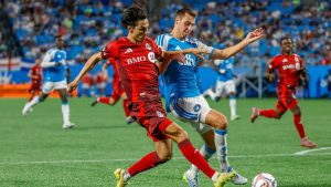 Toronto FC forward Daniel Salloi, left, shoots against Charlotte FC defender Andrew Privett, right, during the second half of an MLS soccer match in Charlotte, N.C., Saturday, May 16, 2026. (Nell Redmond/AP)