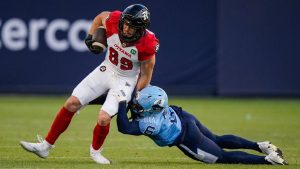 Ottawa Redblacks fullback Marco Dubois (89) is tackled by Toronto Argonauts defensive back Adarius Pickett (6) during first half CFL football action in Toronto, on Sunday, August 13, 2023. (Andrew Lahodynsky/CPj