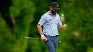 Cameron Young flips his golf ball on the 12th green during third round of the Truist Championship golf tournament at the Quail Hollow Club, Saturday, May 9, 2026, in Charlotte, N.C. (Chris Carlson/AP)