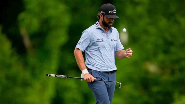 Cameron Young flips his golf ball on the 12th green during third round of the Truist Championship golf tournament at the Quail Hollow Club, Saturday, May 9, 2026, in Charlotte, N.C. (Chris Carlson/AP)