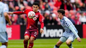Toronto FC forward Emilio Aristizabal (17) moves the ball under pressure from San Jose Earthquakes defender Daniel Munie (5) during first half MLS soccer in Toronto on Saturday, May 2, 2026. (Frank Gunn/CP)