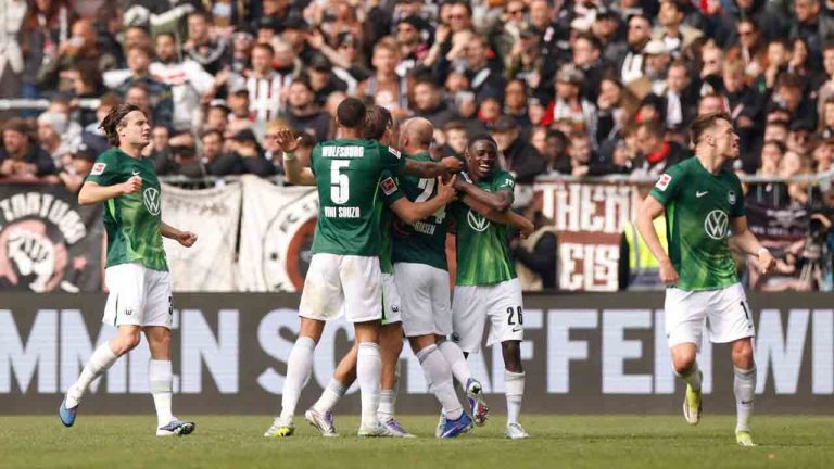 Wolfsburg's players celebrate after their second goal during the German Bundesliga soccer match between FC St. Pauli and VfL Wolfsburg in Hamburg, Germany, Saturday, May 16, 2026. (Christian Charisius/dpa via AP)