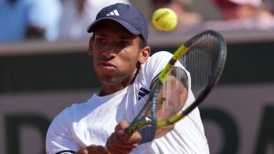 Felix Auger-Aliassime of Canada returns to Roman Andres Burruchaga of Argentina during the second round men's singles tennis match at the French Open tennis tournament in Paris, Thursday, May 28, 2026. (Thibault Camus/AP)