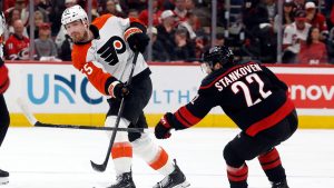 Philadelphia Flyers' Rasmus Ristolainen (55) moves the puck past Carolina Hurricanes' Logan Stankoven (22) during the first period of Game 1 of an NHL hockey Stanley Cup second-round playoff series in Raleigh, N.C., Saturday, May 2, 2026. (Karl DeBlaker/AP)