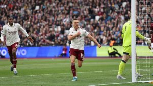 Arsenal's Leandro Trossard celebrates after scoring during the Premier League soccer match between West Ham and Arsenal in London, Sunday, May 10, 2026. (Ian Walton/AP)