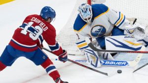 Montreal Canadiens' Cole Caufield (13) scores on Buffalo Sabres goaltender Ukko-Pekka Luukkonen (1) during first period second round, Game 4, Stanley Cup Playoff action in Montreal on Tuesday, May 12, 2026. (Christinne Muschi/THE CANADIAN PRESS)