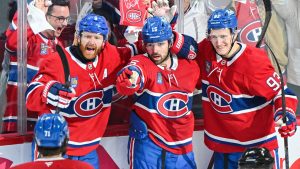 Montreal Canadiens' Alex Newhook (15) celebrates with teammates Mike Matheson (8), Jake Evans (71) and Ivan Demidov (93) after scoring against the Buffalo Sabres during first period, second round, game 4, NHL playoff hockey action in Montreal on Tuesday, May 12, 2026. (Graham Hughes/CP)