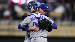 Toronto Blue Jays pitcher Louis Varland (77) celebrates with catcher Tyler Heineman (55) after winning 7-3 against the Minnesota Twins following a baseball game Friday, May 1, 2026, in Minneapolis. (Stacy Bengs/AP)