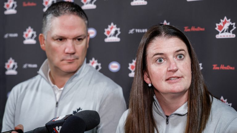 Canada’s National Women’s Team general manager Gina Kingsbury, right, speaks to the media as head coach Troy Ryan looks on at Hockey Canada’s National Teams orientation camp in Calgary, Thursday, Aug. 28, 2025. (Jeff McIntosh/CP)