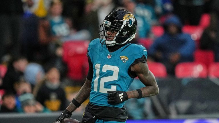 Jacksonville Jaguars wide receiver Travis Hunter (12) scores a touchdown during the second half of an NFL football game between the Los Angeles Rams and the Jacksonville Jaguars in London, Sunday, Oct. 19, 2025. (Kin Cheung/AP)