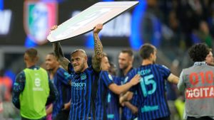 Inter players celebrate the victory of their 21st championship after a Serie A soccer match between Inter Milan and Parma, in Milan, Italy, Sunday, May 3, 2026. (Luca Bruno/AP)