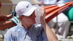 Jannik Sinner of Italy cools himself with the ice during the second round men's singles tennis match against Juan Manuel Cerundolo of Argentina at the French Open tennis tournament in Paris, Thursday, May 28, 2026. (Thibault Camus/AP)