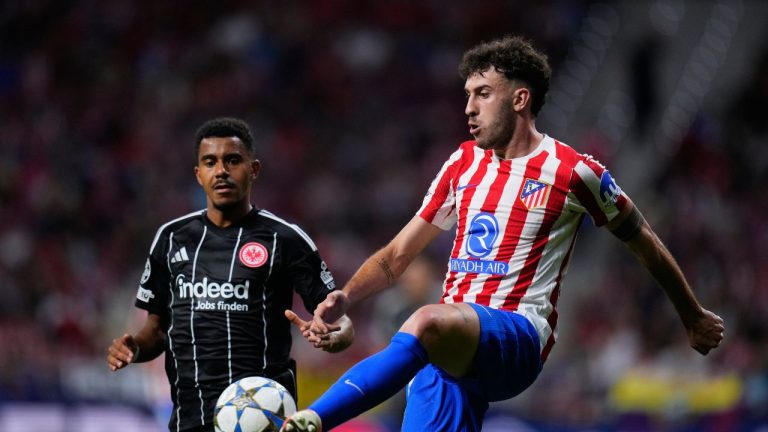 Frankfurt's Ansgar Knauff, left, and Atletico Madrid's Johnny Cardoso challenge for the ball during the Champions League opening phase soccer match between Atletico Madrid and Eintracht Frankfurt at the Metropolitano stadium in Madrid, Spain, Tuesday, Sept. 30, 2025. (Manu Fernandez/AP)