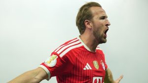 Bayern's Harry Kane celebrates after scoring during the German Cup final soccer match between VfB Stuttgart and Bayern Munich in Berlin, Germany, Saturday, May 23, 2026. (Michael Kappeler/dpa via AP)