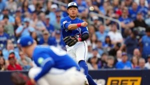 Toronto Blue Jays third baseman Kazuma Okamoto (7) makes a throw toward first base over Toronto Blue Jays pitcher Braydon Fisher (63) against the Miami Marlins during first inning MLB action in Toronto on Tuesday May 26, 2026. (Frank Gunn/THE CANADIAN PRESS)