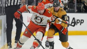 Anaheim Ducks left wing Jeffrey Viel (28) and Vegas Golden Knights right wing Pavel Dorofeyev (16) vie for the puck during the first period of Game 1 of a second-round  Stanley Cup Playoffs series Monday, May 4, 2026, in Las Vegas. (John Locher/AP Photo)